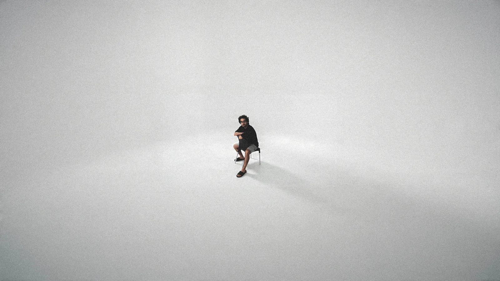 Ali seated in an open studio